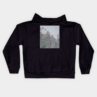 Old ferris wheel in snow Kids Hoodie